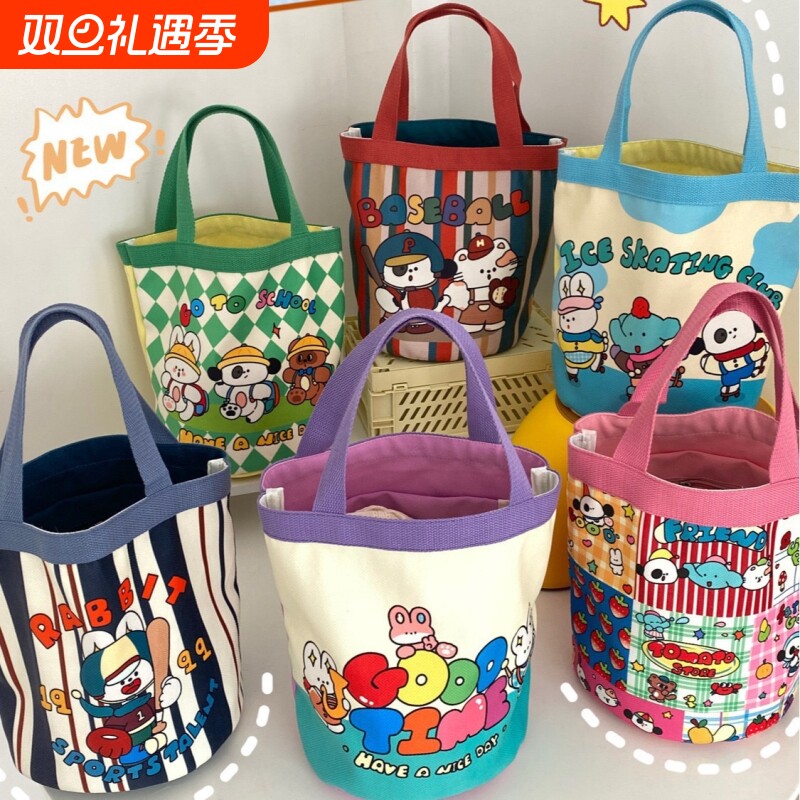 可爱涂鸦水桶包ins印花圆筒包帆布便当袋韩风少女手拎饭盒妈咪包