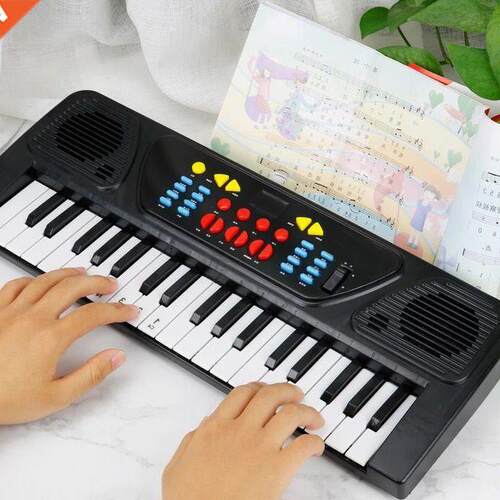 7 key children	s electronic organ toy with microphone