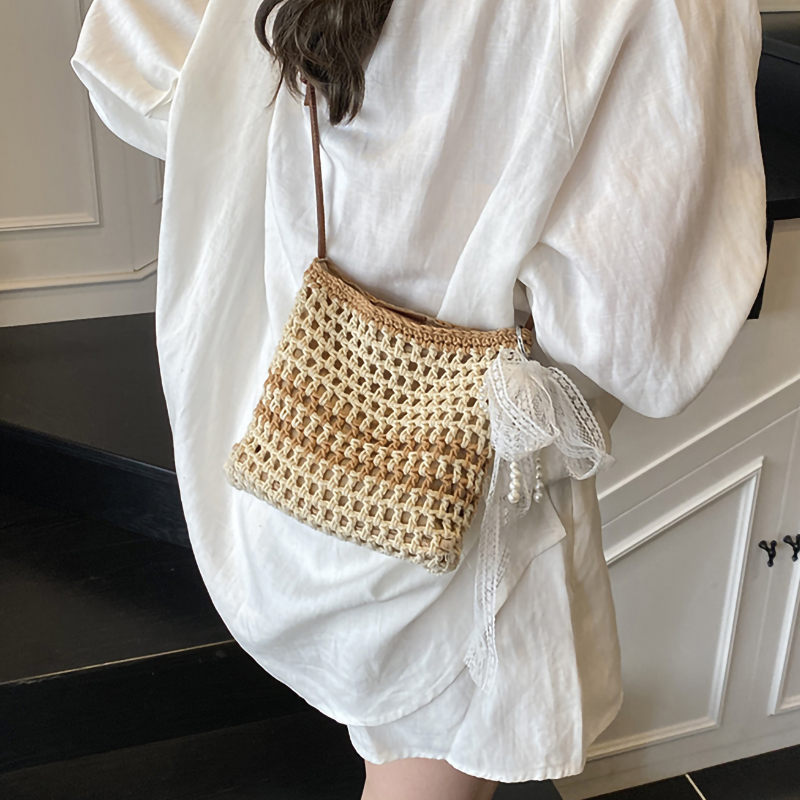 夏季镂空编织小包包女2025新款洋气休闲单肩包海边度假沙滩水桶包