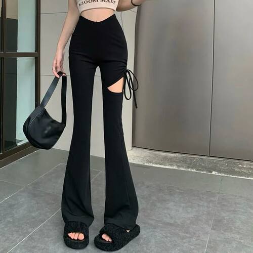 Solid color perforated micro pull pants 纯色破洞修身微喇裤女