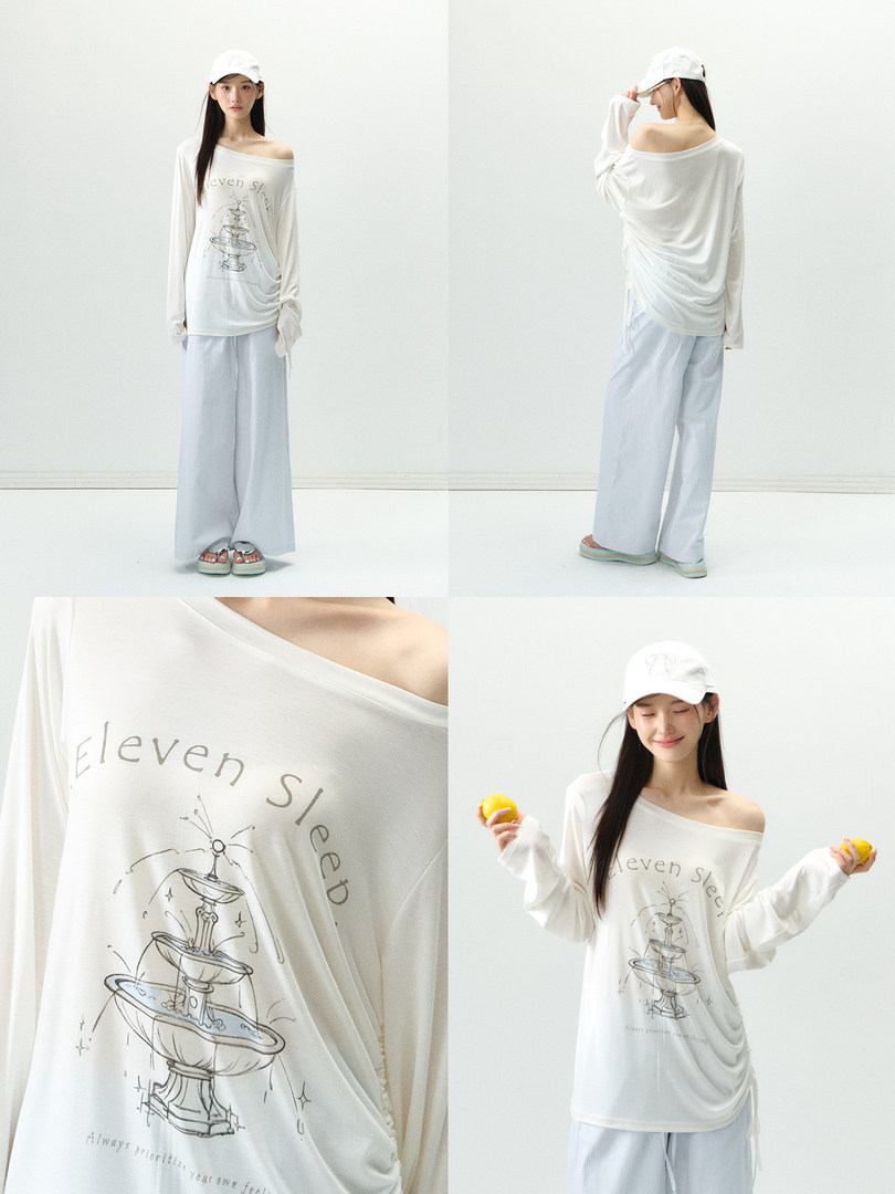 White off-shoulder long-sleeve top and wide-leg pants worn by a model