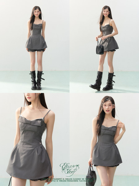Gray sleeveless mini dress worn by a model with black boots