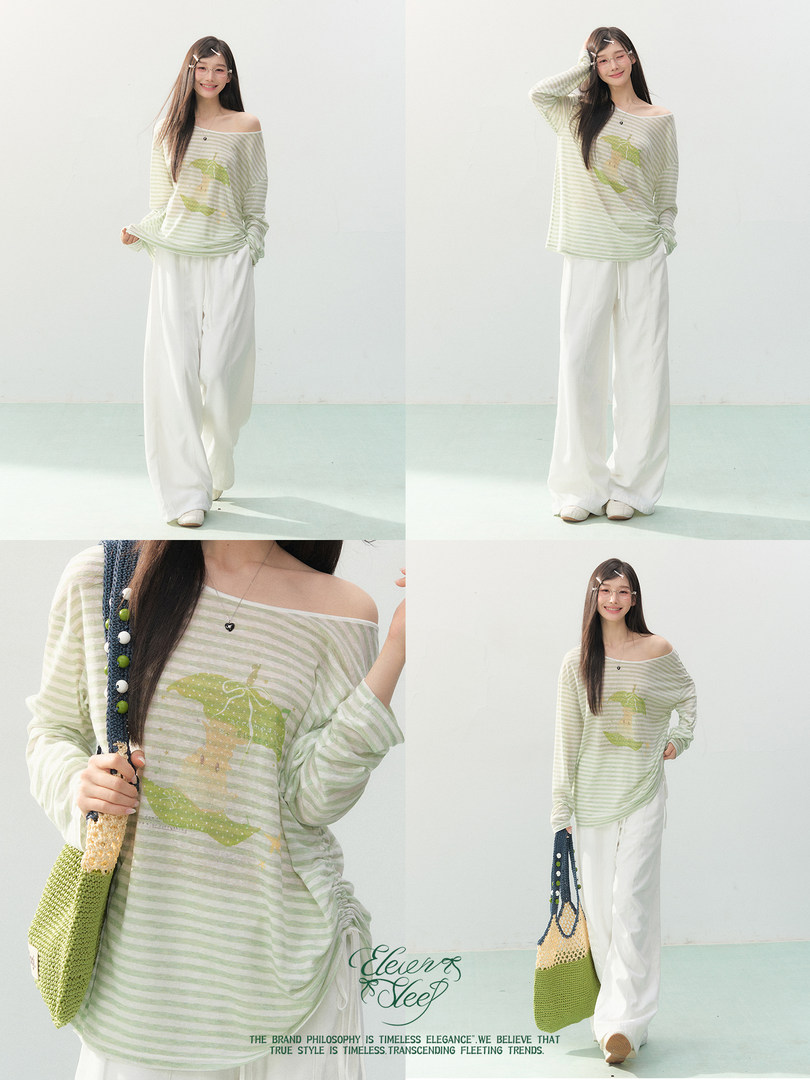 Model wearing a light green striped off-shoulder top with loose white pants