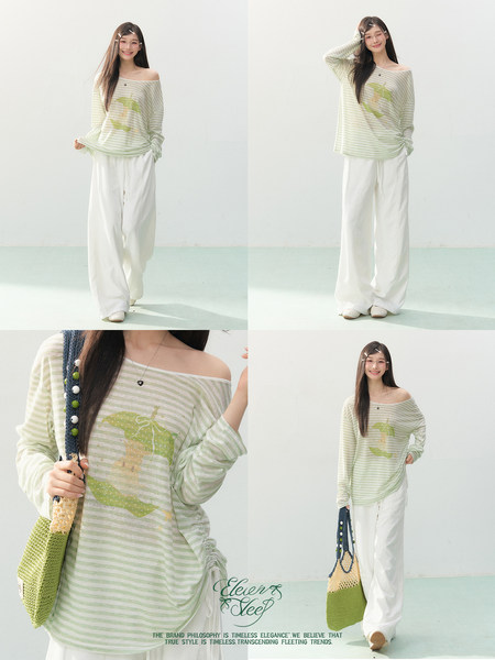 Model wearing a light green striped off-shoulder top with loose white pants