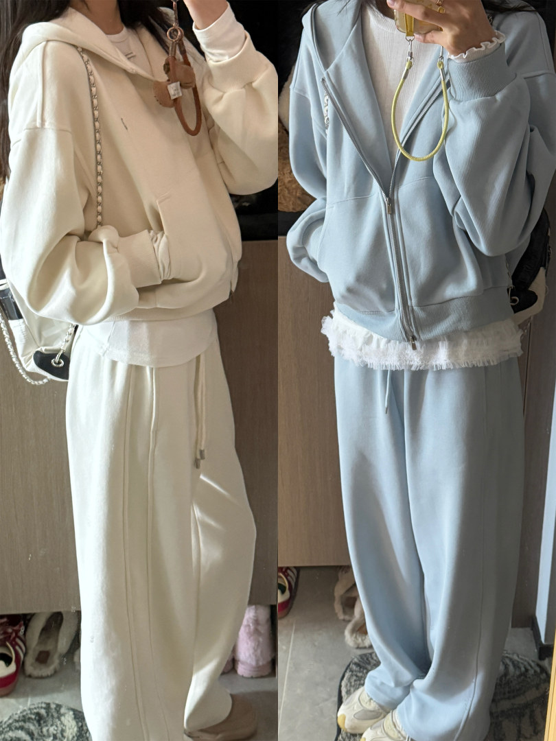 Two pastel loungewear sets with zip hoodies and wide-leg pants worn in mirror selfies