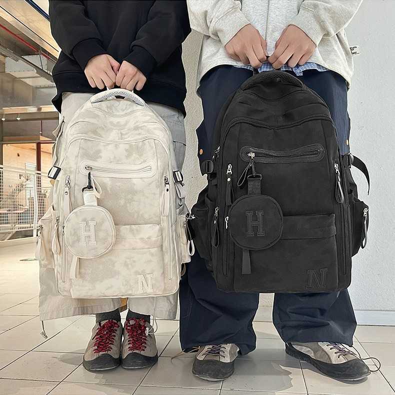 潮流大容量双肩包个性设计感涂鸦男女背包轻便减负中学生书包