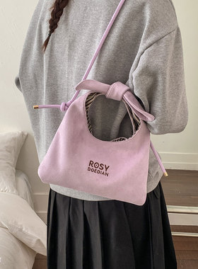 小众紫色蝴蝶结手提包女2026新款潮麂皮可爱通勤气质单肩斜挎包