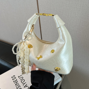 小众设计斜挎包 时尚 高级感铆钉简约饺子包2025春季 潮流单肩包韩版