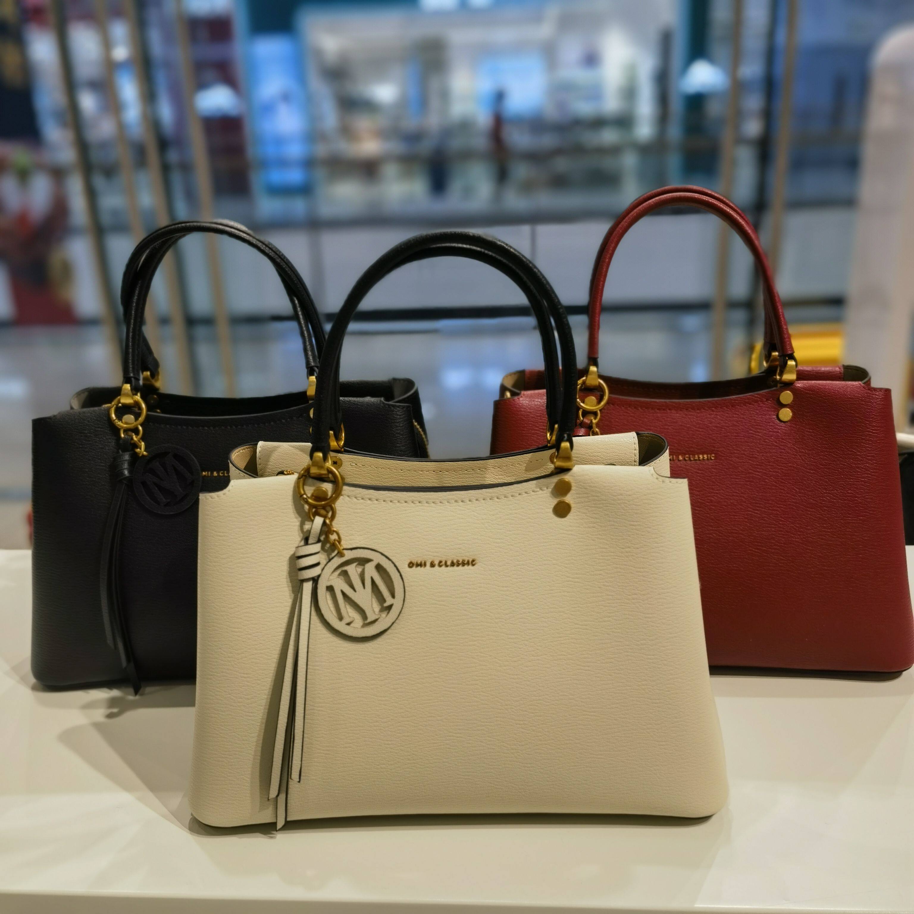 OMI欧米万达专柜新款时尚百搭女士手提斜挎牛皮高质感女包