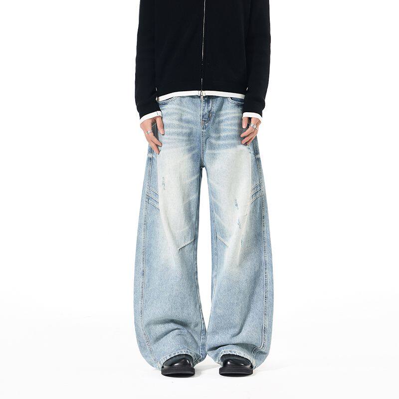 复古水洗磨破猫须弯刀牛仔裤