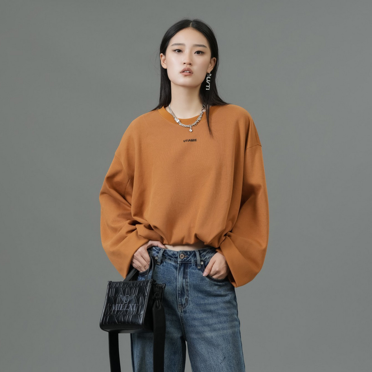 uti尤缇2025春季新款 桔黄色套头圆领长袖卫衣女上衣UK140109133