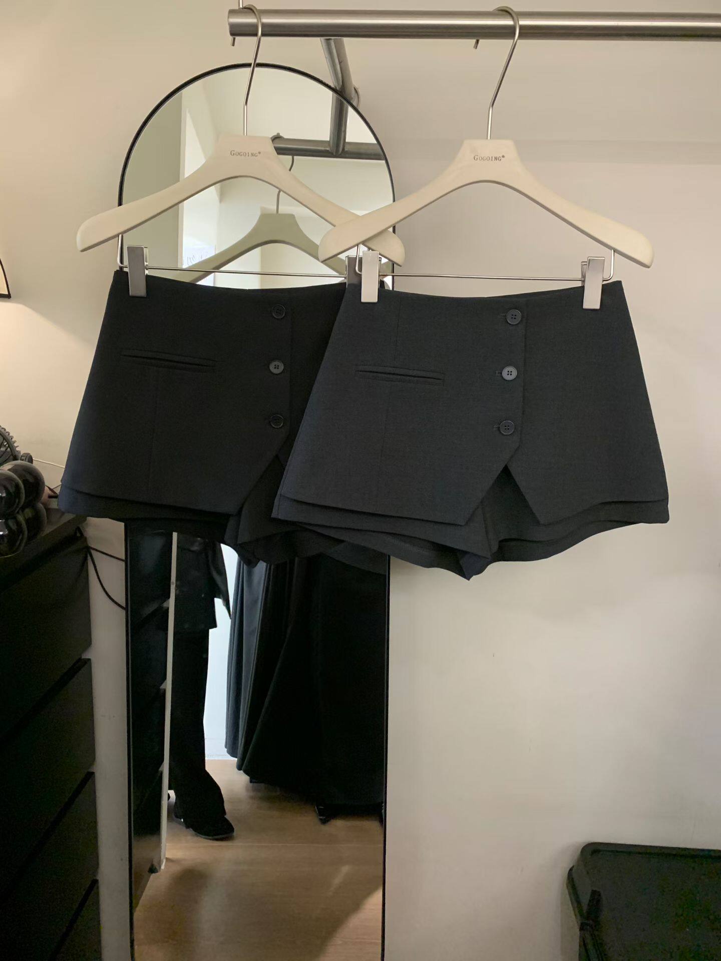 Gogoing2026早春新款气质不规则一排扣口袋西装半身裙短裙A字裙