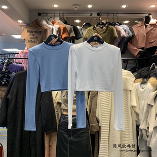 东大门十三行短款垫肩长袖圆领T恤早春新款修身显瘦打底衫上衣