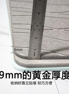 The silicon silica squid-smelling mats the bathroom doorway,