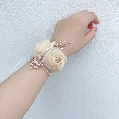 The wrists of the bridesmaids and the wrists of the bridesma