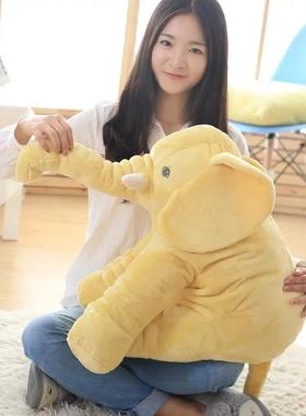 Soft elephants holding a pillowy toy elephants sleeping with