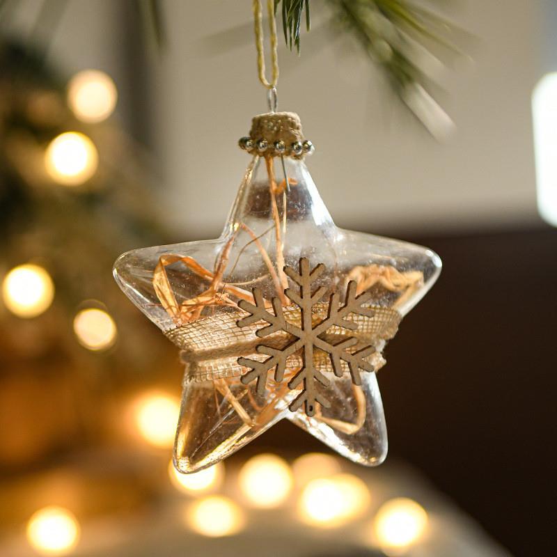 The glass-transparent Christmas ball with a white platter an
