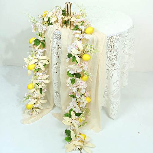 Simulate a lemon twig of lemon leaves and grass and a green