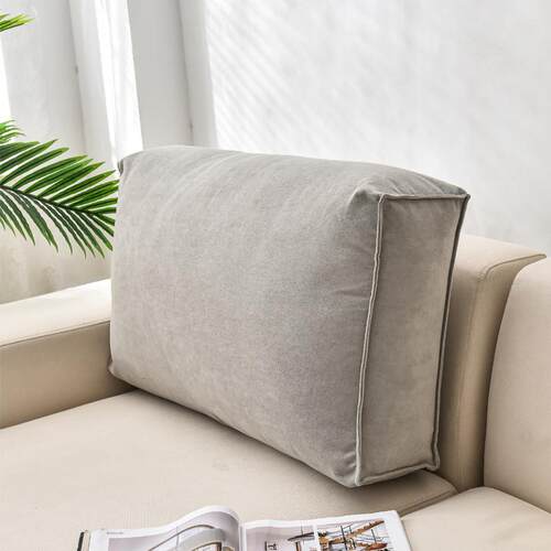 A rectangular sofa with a mattress and a pillow with a scuff