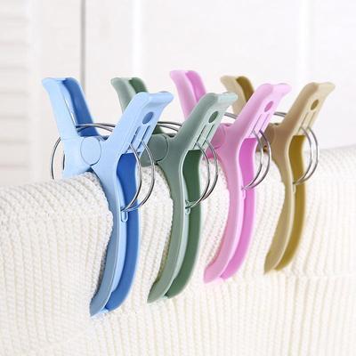 Large plastic clothespins for home use, suitable for securin