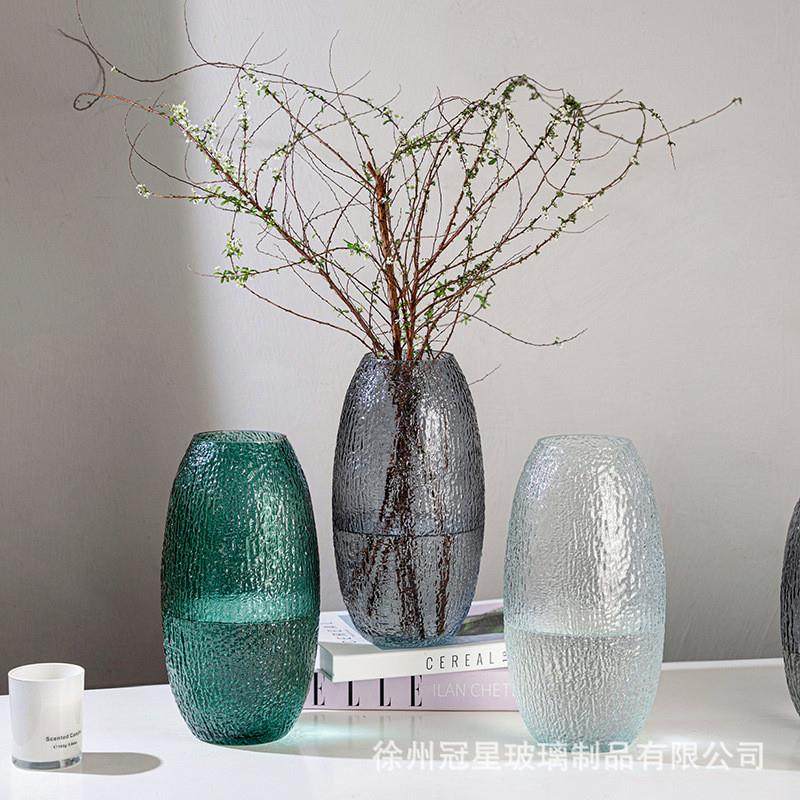 Ancient glass bottles of water to grow green flower living h