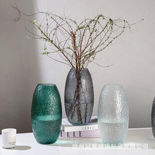 Ancient glass bottles of water to grow green flower living h