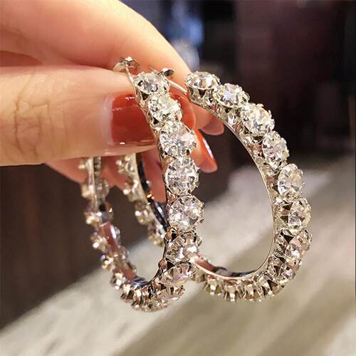Hes got big earrings, big ear nails on E.U.S. Fashion Stree