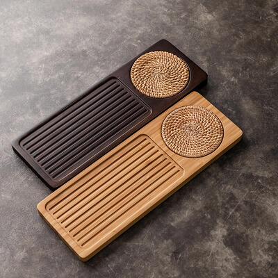 The walnut-coloured tea plate for the familys kung fu tray,