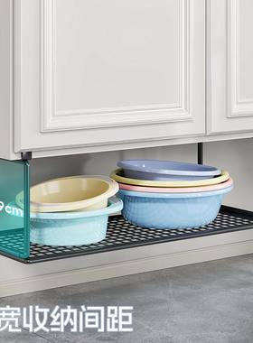 In the bathroom cabinet, the bottom of the washbasket, the b