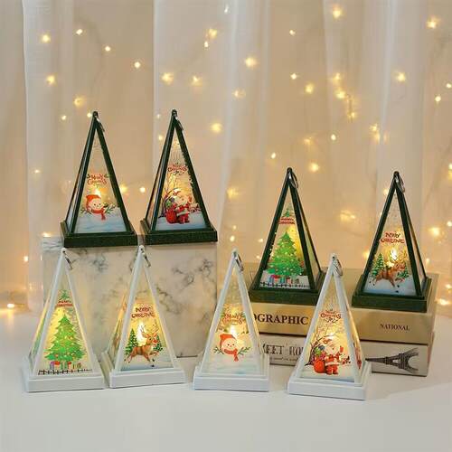 Christmas decorations with a triangle light hanging on a