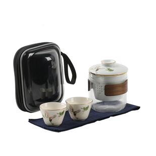 Two cups of ceramic tea cups outside of a portable tourist t