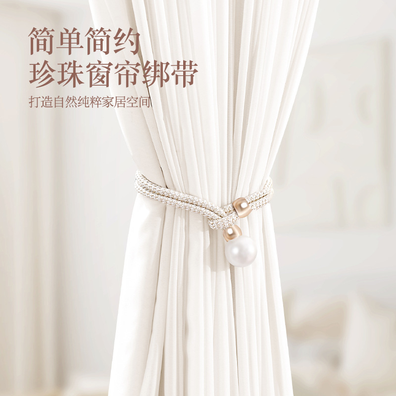 A pair of luxury high-end pearl curtain tiebacks for the liv