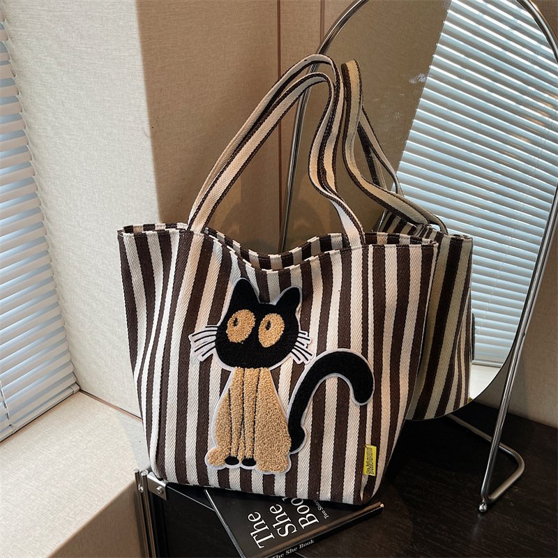 韩系高质量帆布包2025新款上班族斜挎手提袋女士包包大容量慵懒风