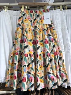 橘黄色油画碎花半身裙女夏季2026新款松紧高腰棉布a字口袋伞裙子