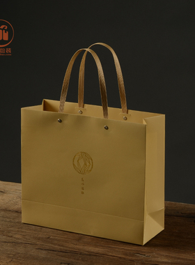 黄色十股绳烫金纸袋时尚彩印压花纸衣服礼品袋购物袋环保袋手提袋