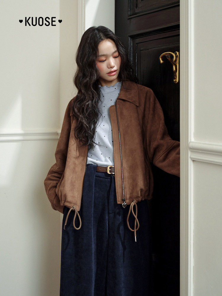 Brown zip-up jacket worn by a model
