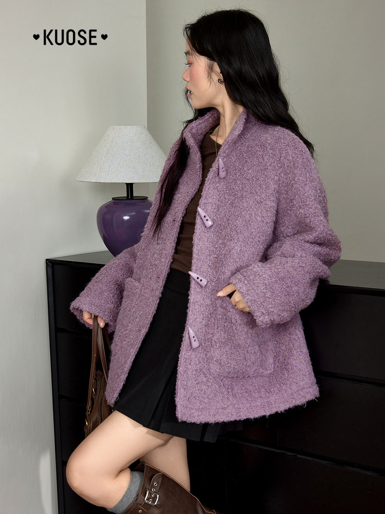 Woman wearing a lavender fuzzy coat styled with a skirt