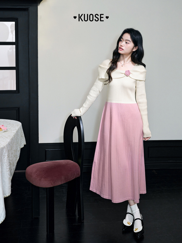 Model wearing a cream and pink long-sleeve knit dress with a logo collar detail