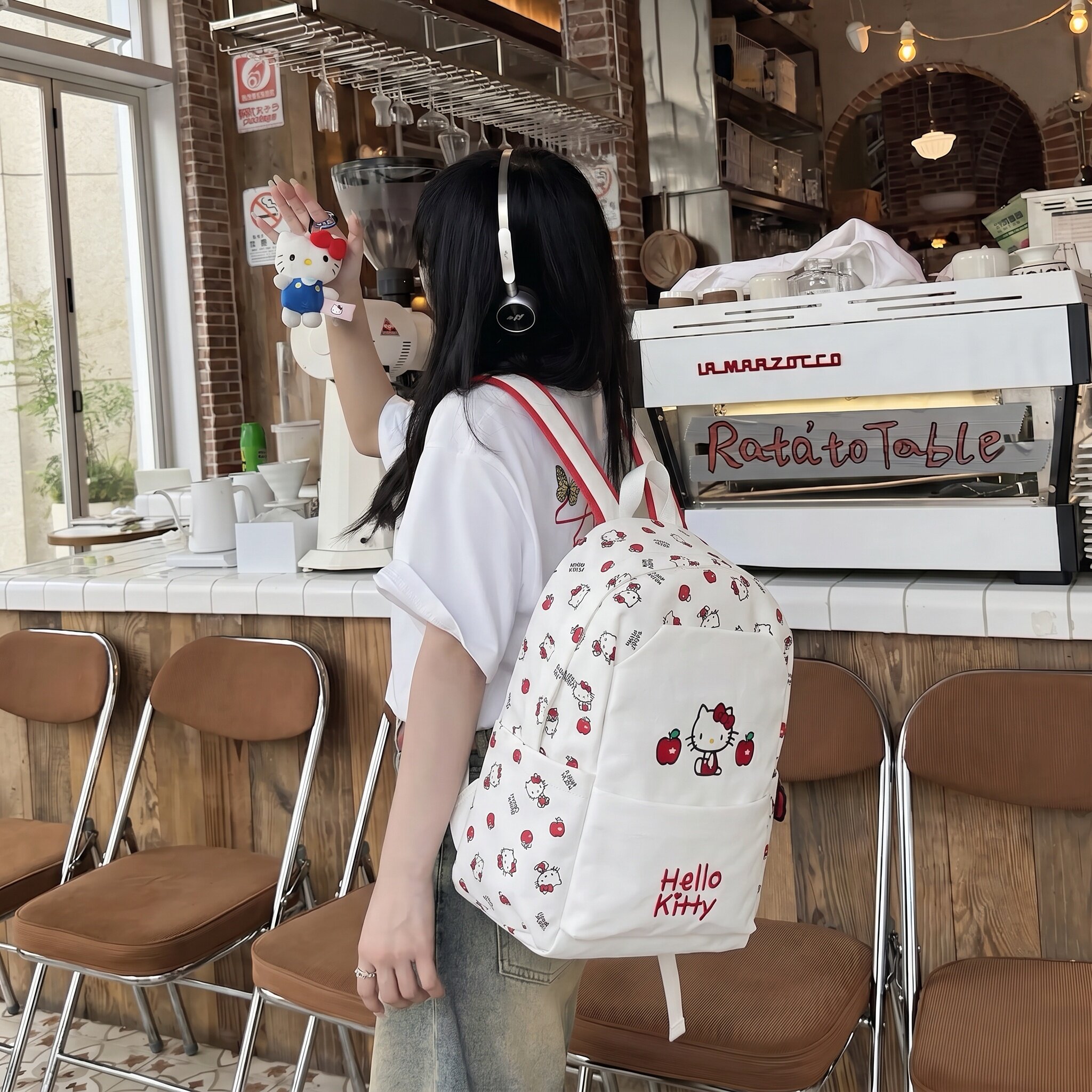 三丽鸥正版凯蒂猫卡通双肩包女学生印花蝴蝶结可爱白色书包大容量