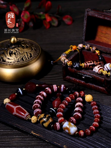Лидер команда ювелирные украшения лотос бутылка бутылка Tiger Tiger Beads Cinnabar поставляет девять глазных овец тибетские бусины Zhenpin