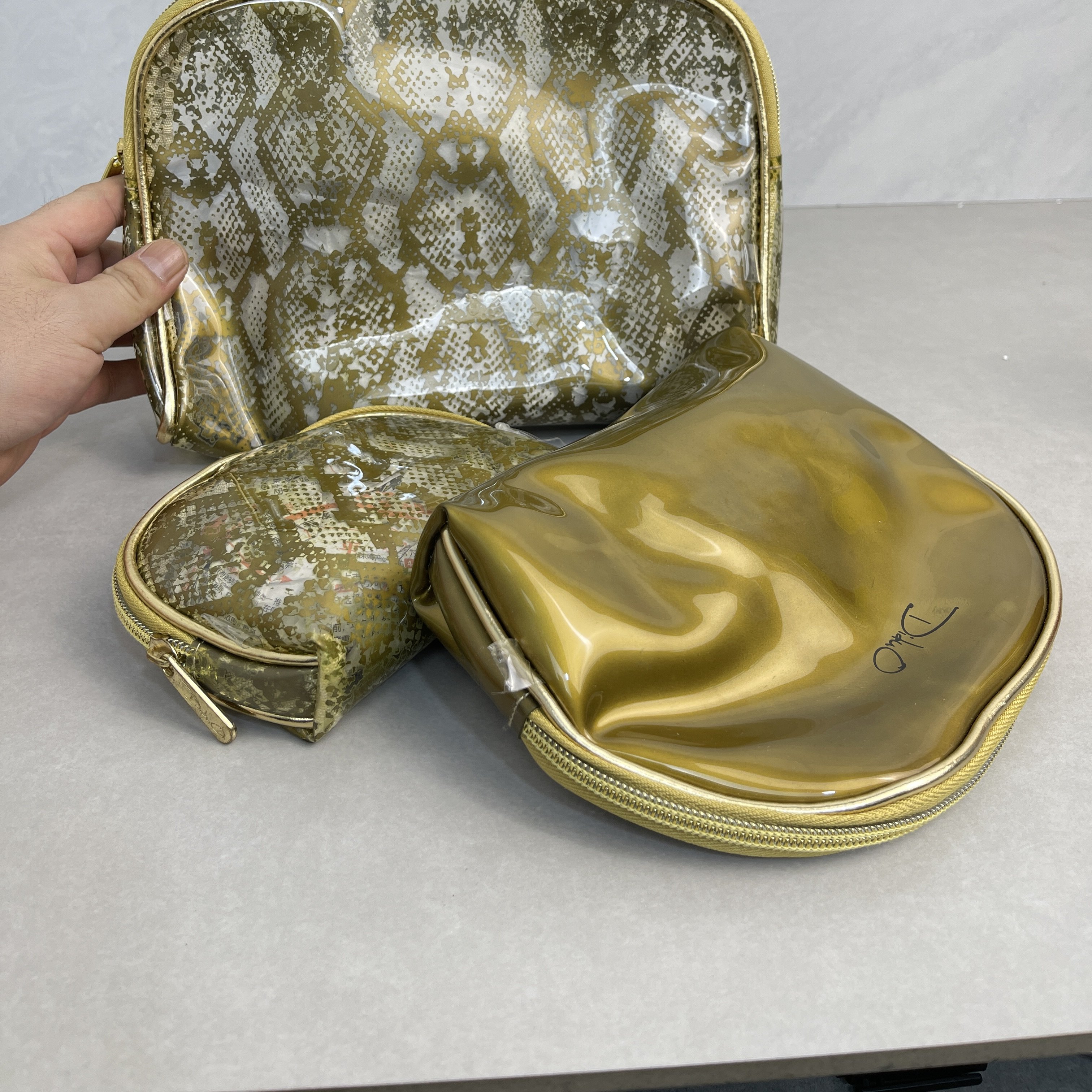 正品迪朵商撤柜清仓女包欧美时尚金色手拿包女休闲欧美手包包女图片