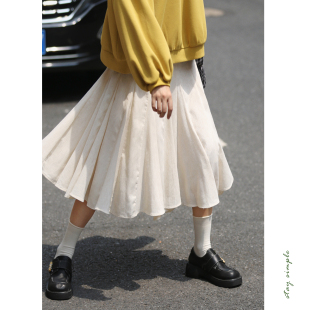 花吉Q552豆乳色多裁片拼接高腰设计感小众半身裙2026新款秋花瓣裙