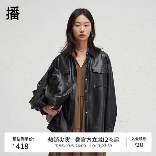 前短后长微开衩下摆，.袖口一粒扣点缀