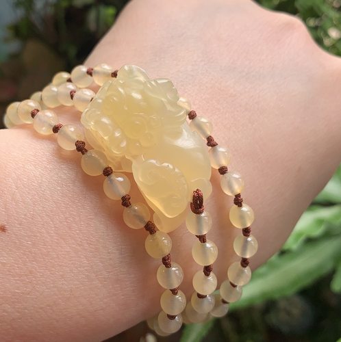 杨玉家天然黄龙玉手串证书