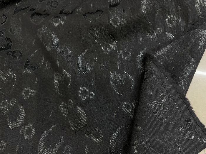服装黑色底亮丝羽毛织锦提花布料