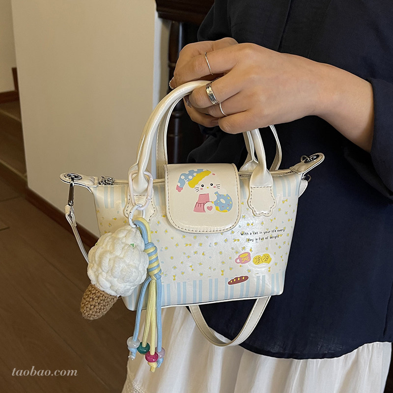 可爱萌少女印花包包女2026新款独特小众百搭斜挎包精致手提饺子包