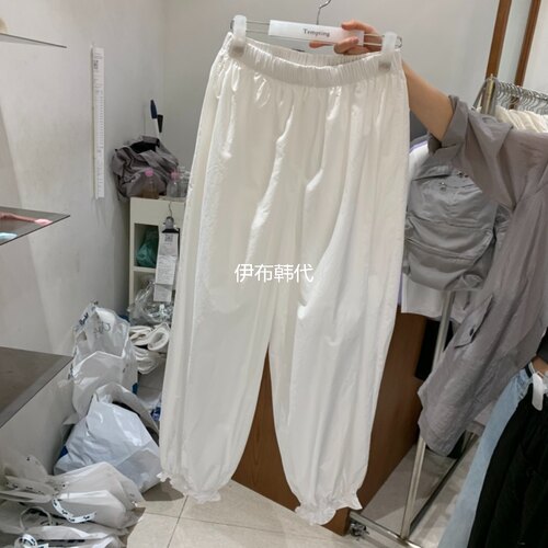 春款松紧腰木耳边裤脚紧腿长裤