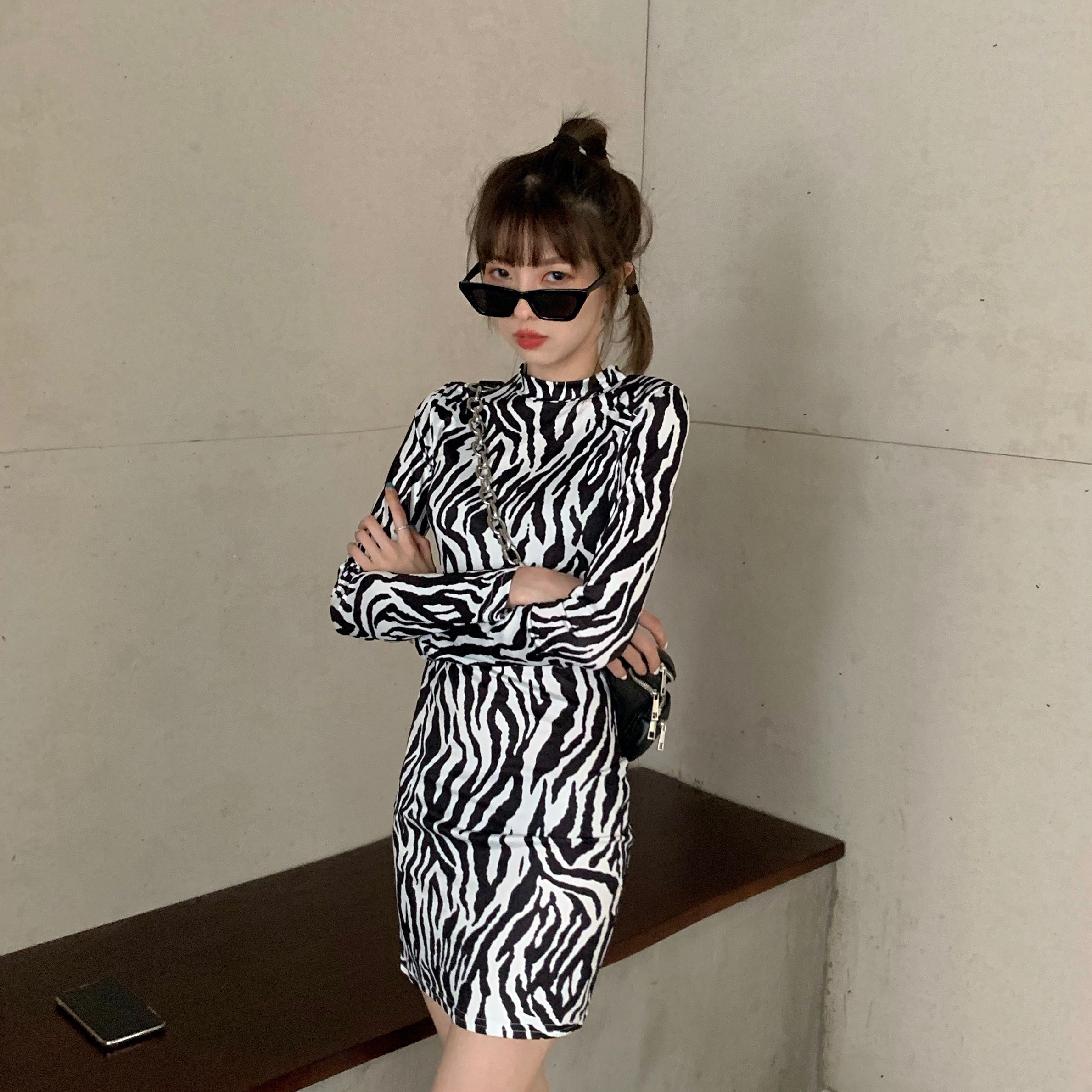 A slim long sleeve dress with half high collar