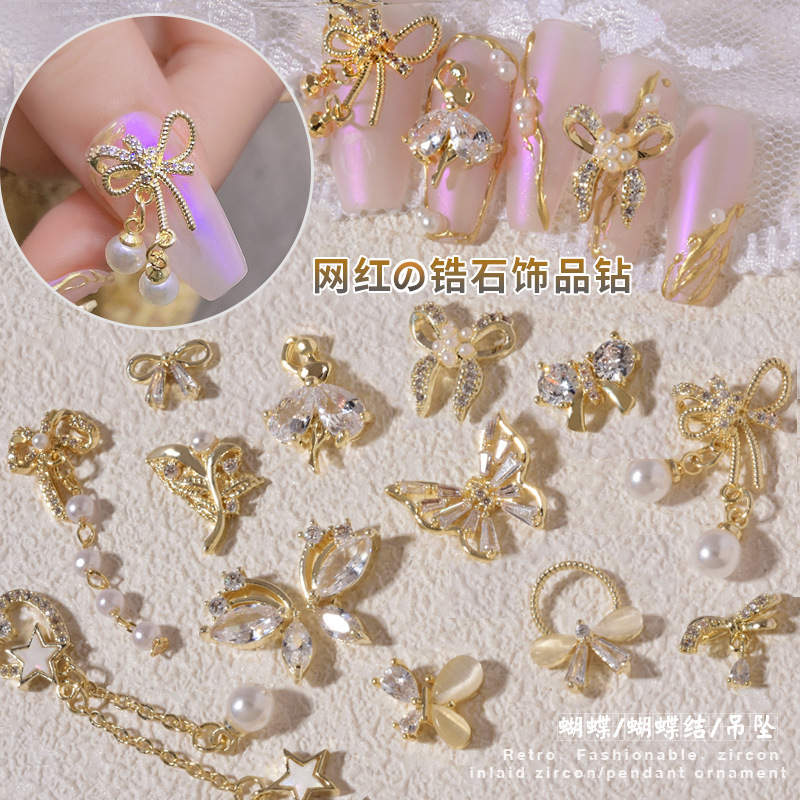 2023新款美甲锆石饰品蝴蝶结珍珠爱心吊坠网红蝴蝶保色指甲装饰钻