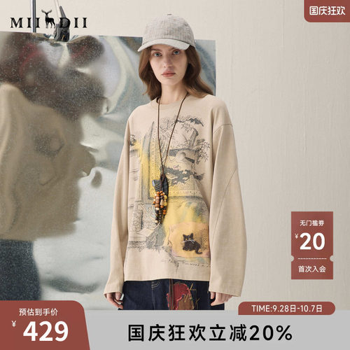 蜡染面料柔软贴身，复古印花，微落肩设计。